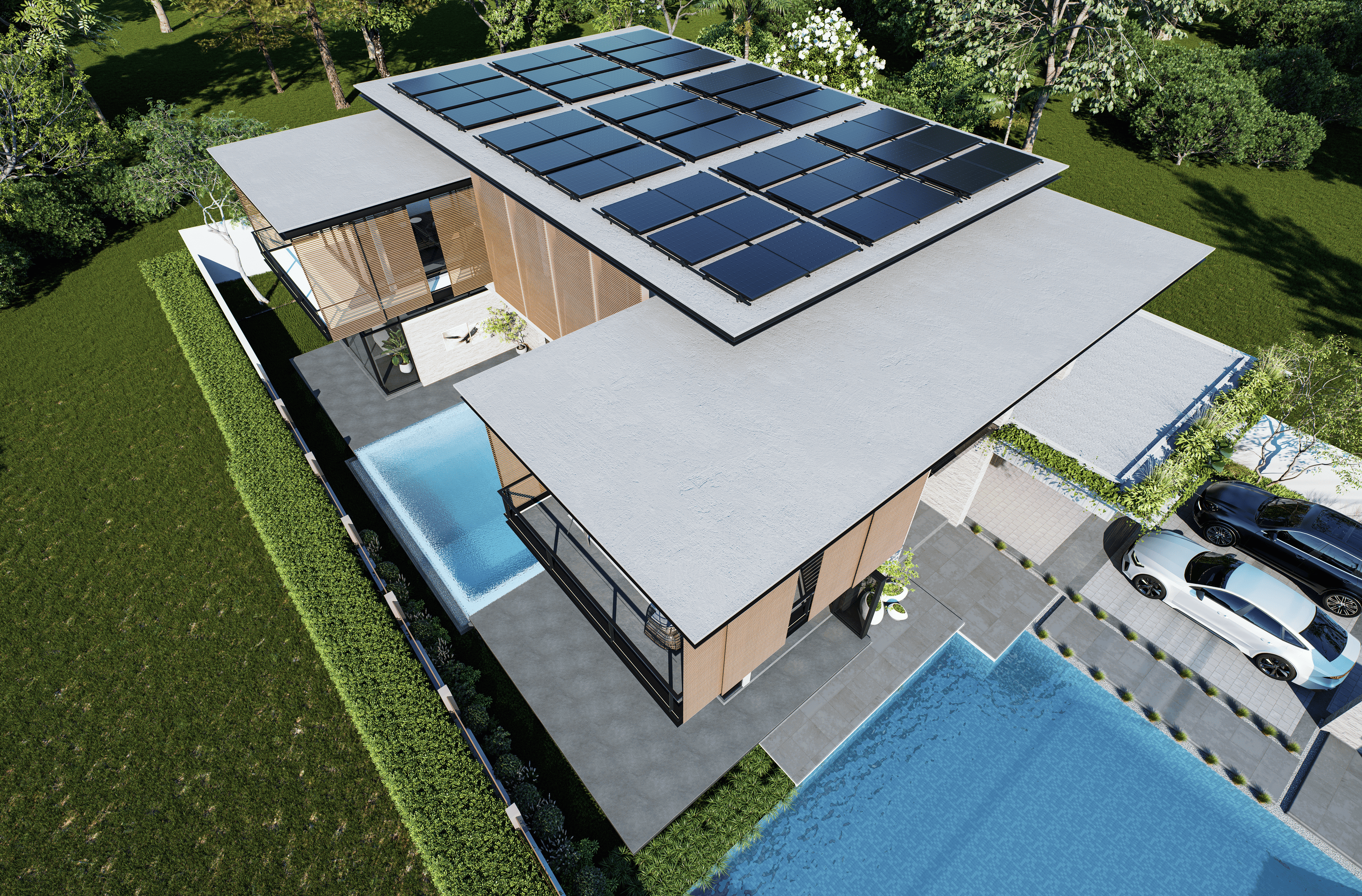 Aerial view of a modern, flat-roofed house with solar panels, surrounded by greenery. The property features two pools, a driveway, and parked cars.