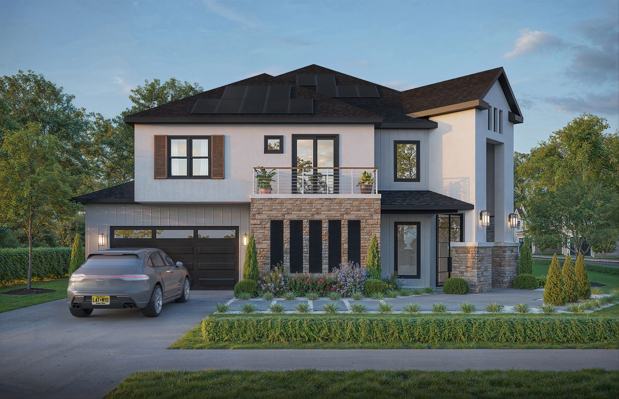 Modern two-story house with solar panels, stone and siding exterior, balcony, and landscaped yard. A car is parked in the driveway.